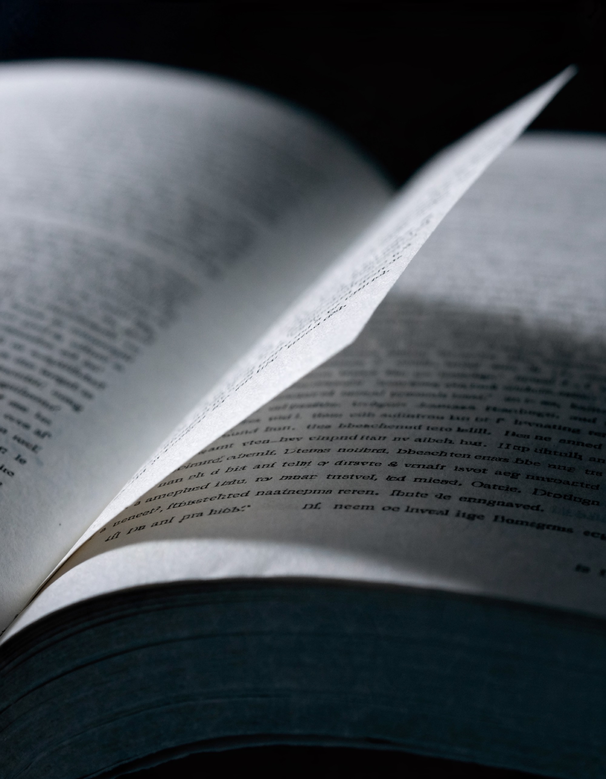 A correction slip pasted flat over the lines of a printed page it corrects, its bottom edge lifting.